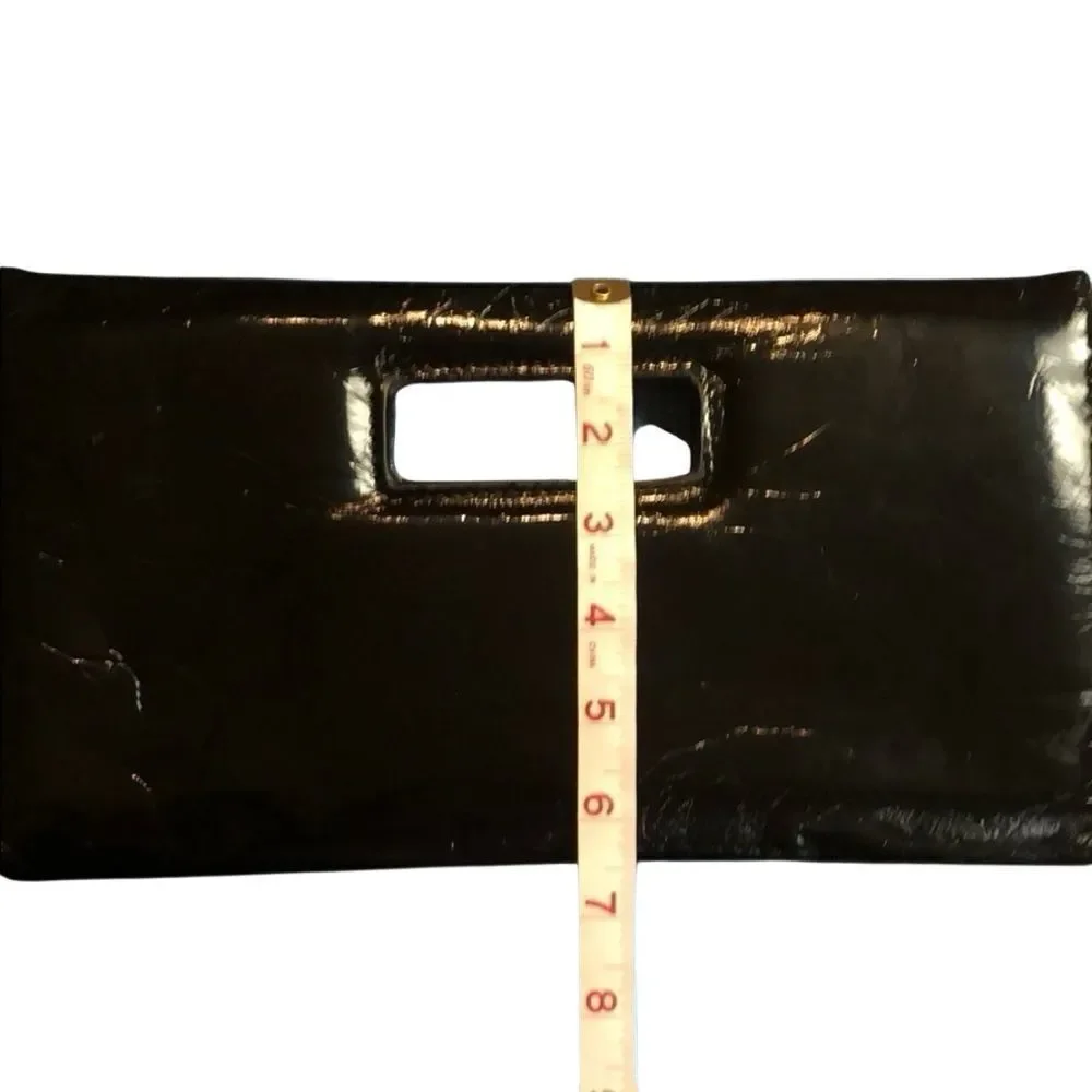 Gap black shiny clutch with zebra print inside